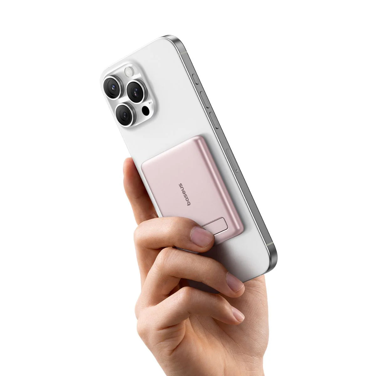 Hand holding a smartphone with a pink case on a white background
