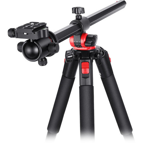 Black and red camera tripod on a white background