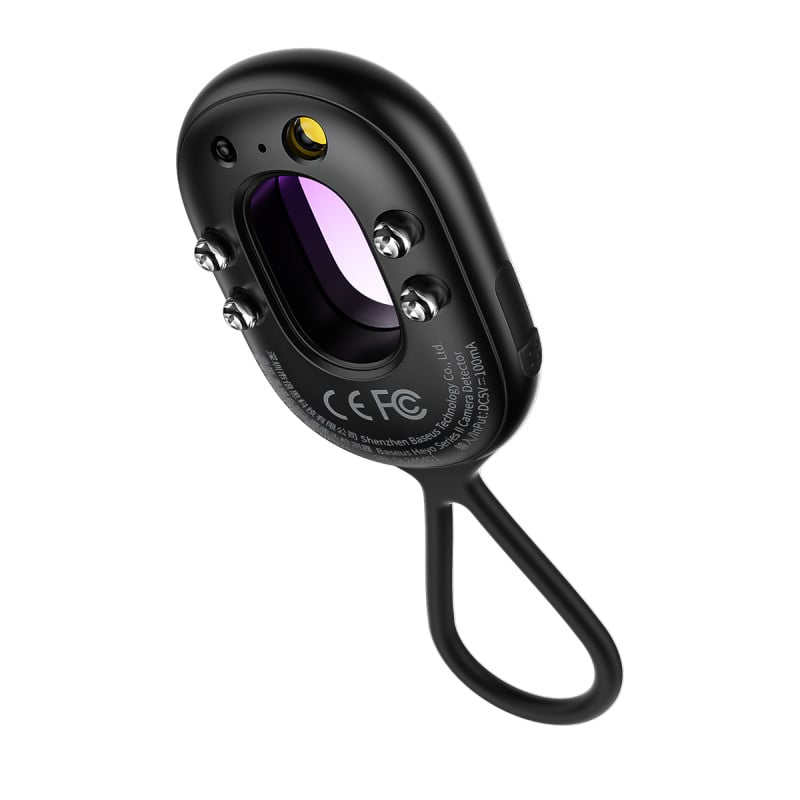 Black camera lens with purple interior on a white background