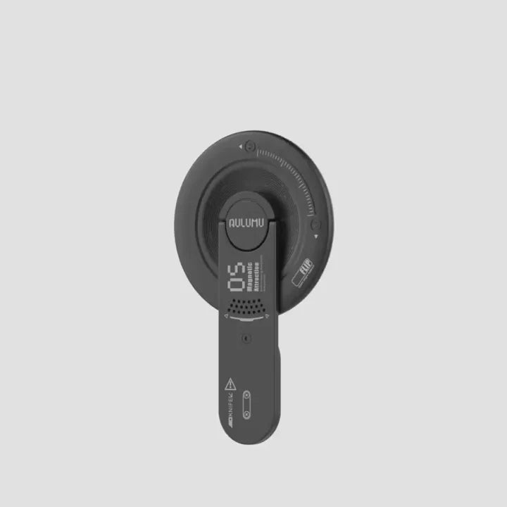 Black electronic device with digital display on a light gray background