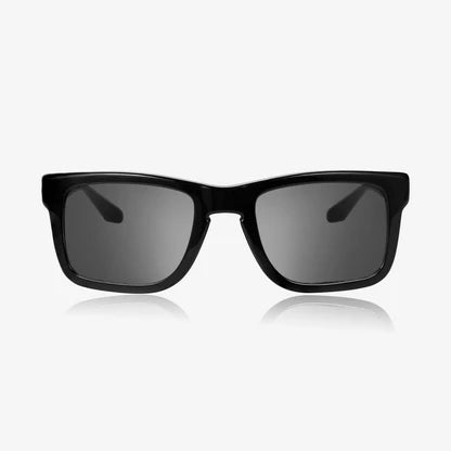 Black sunglasses with dark lenses on a white background