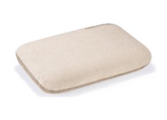 Beige bath pillow on a white background