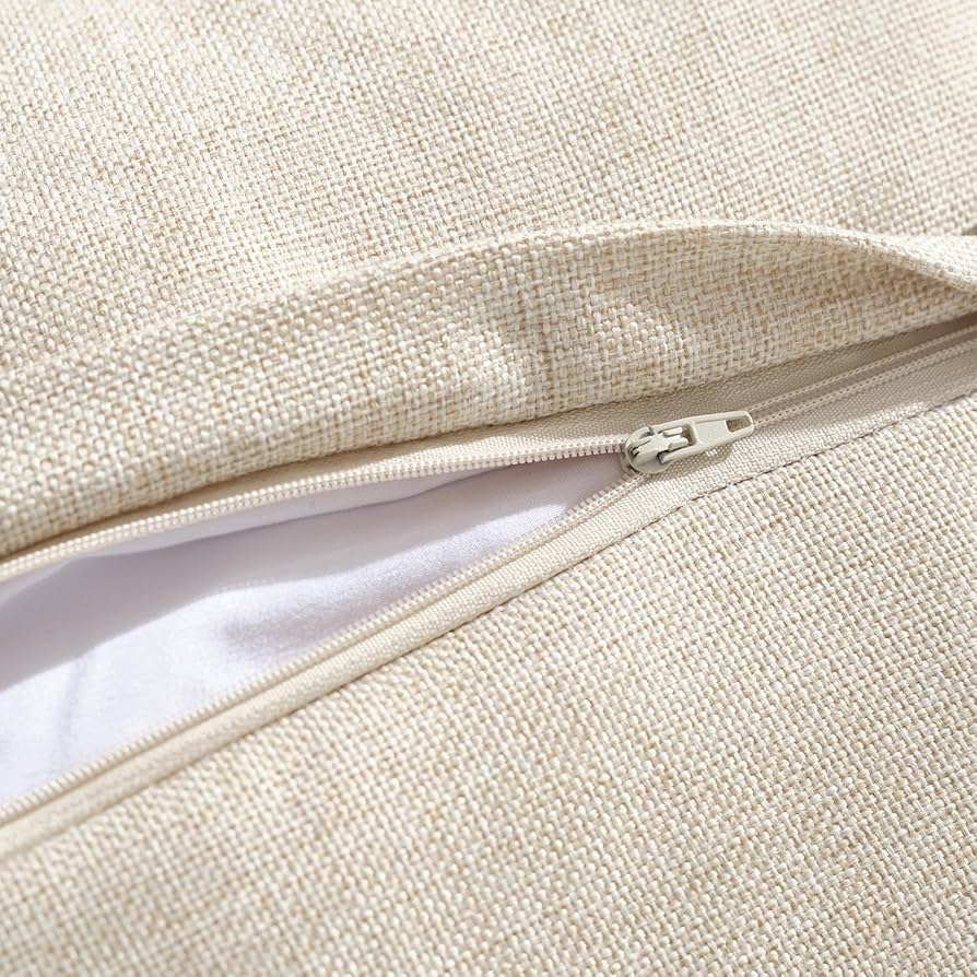Close-up of a beige fabric bag with a zipper
