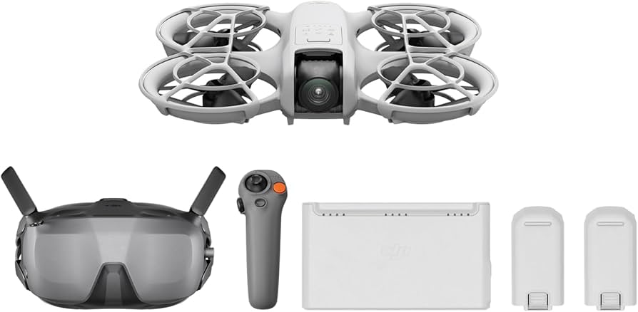 White drone with goggles, remote control, and accessories on a white background