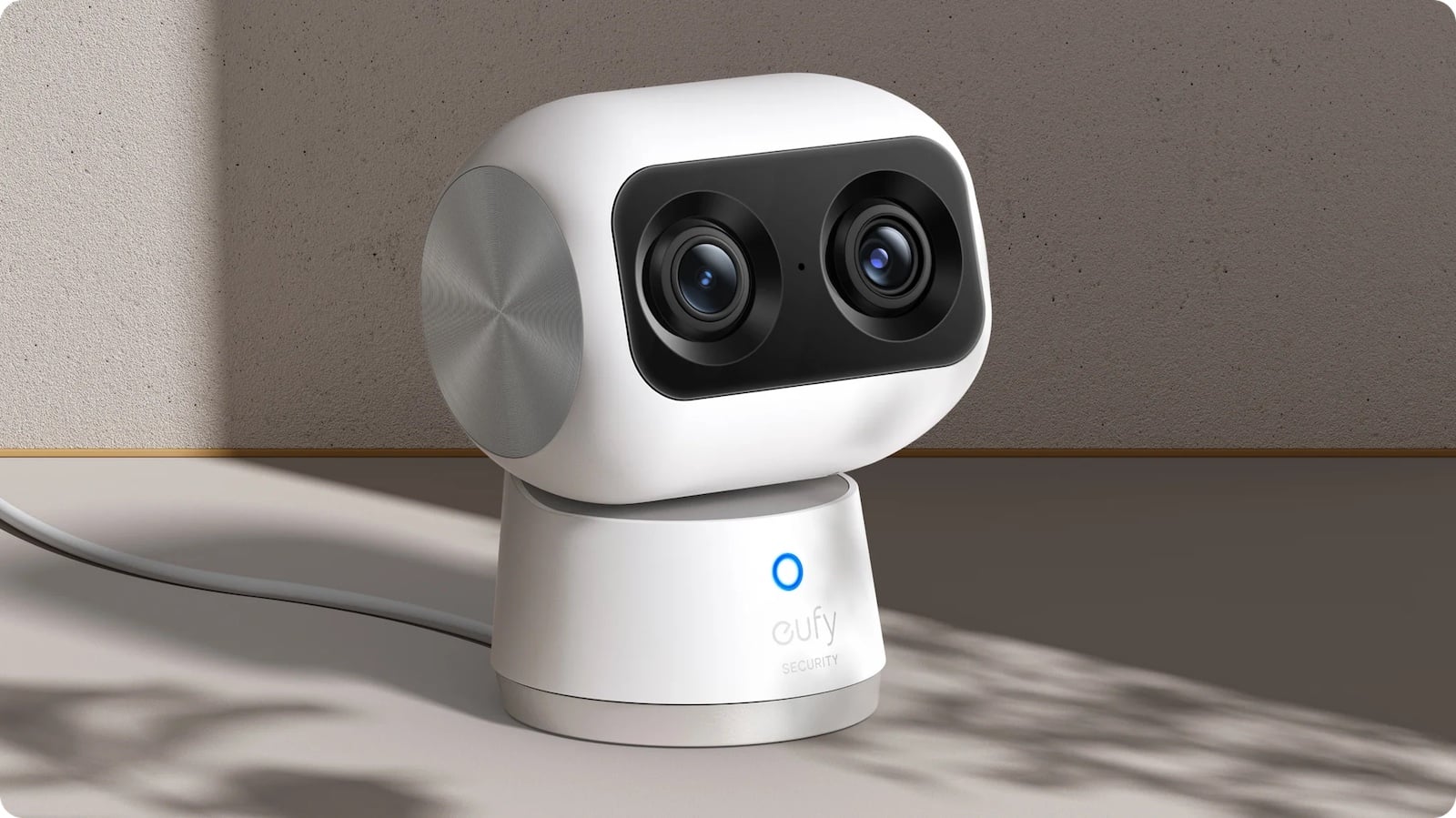 White robot with camera on a neutral background