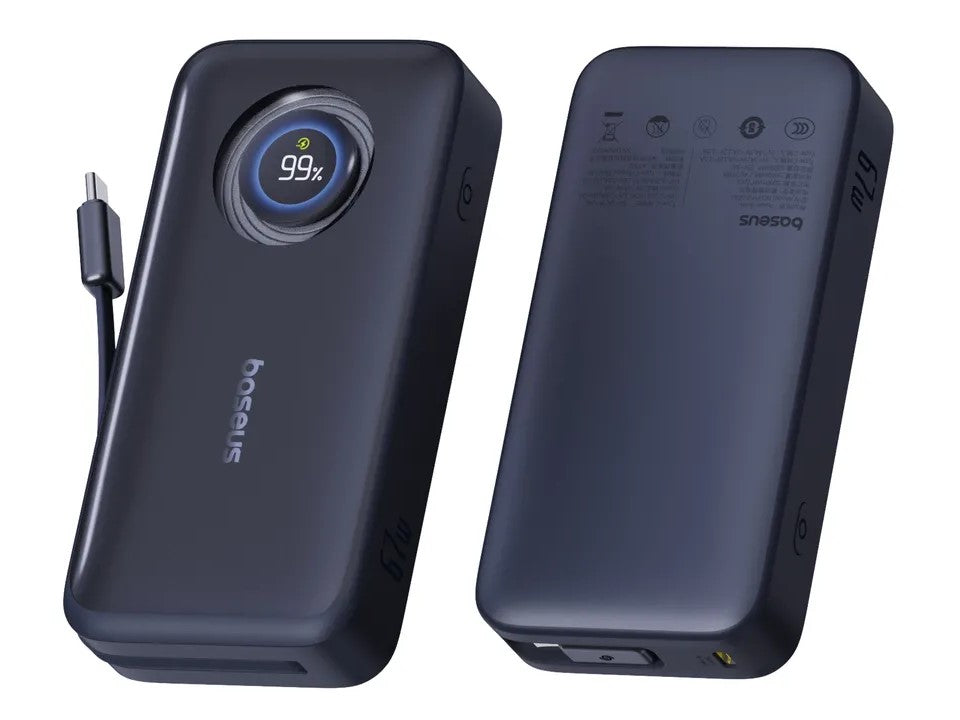 Black power bank with digital display and charging cable on a white background