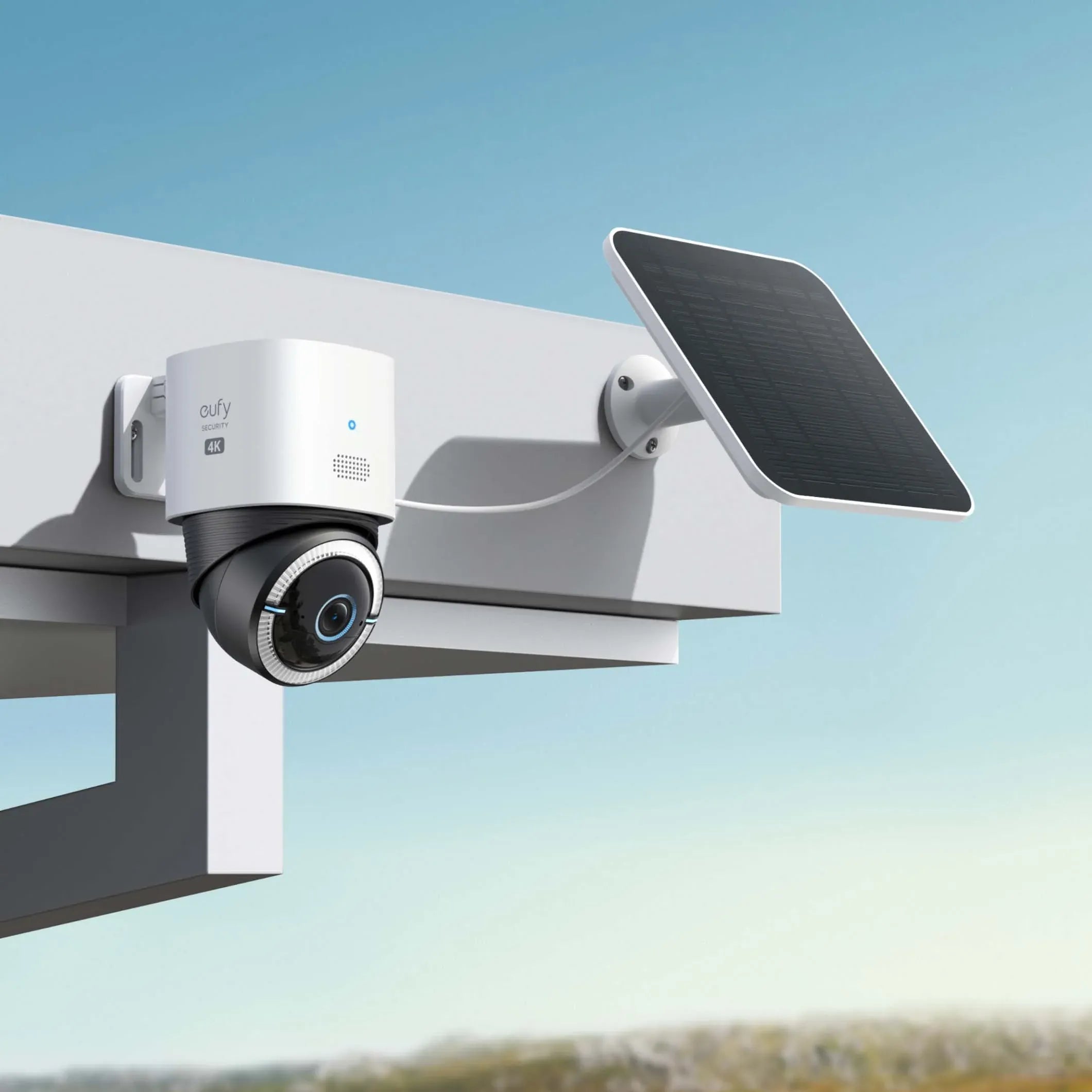 Smart camera with solar panel on a clear sky background