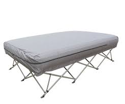 Folding bed with gray mattress on a white background