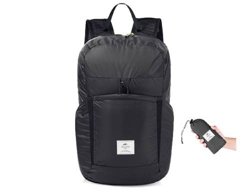 Black backpack with a remote control on a white background