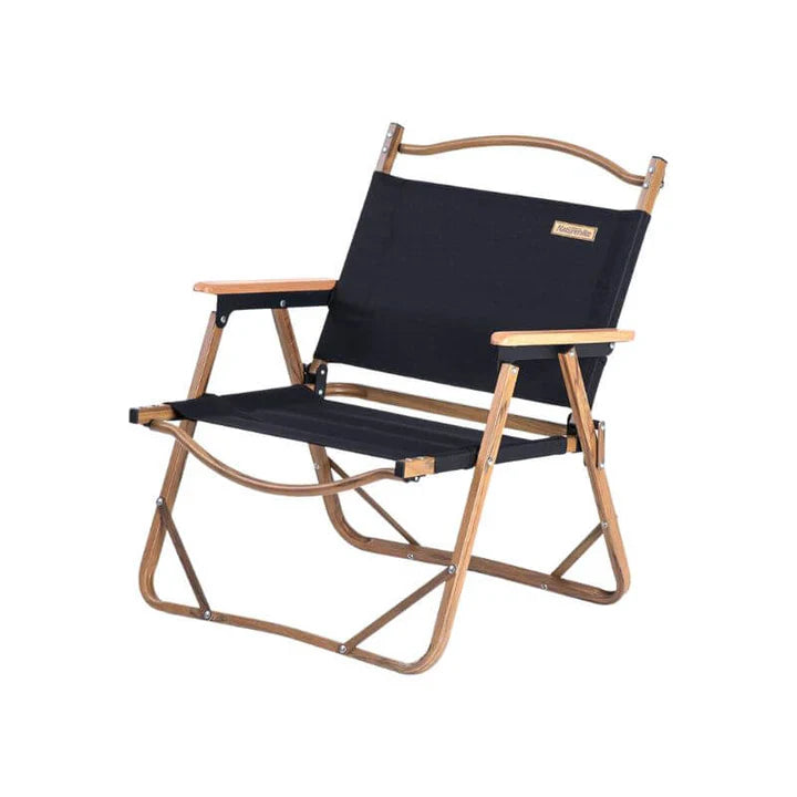 Folding chair with black seat and backrest on a white background