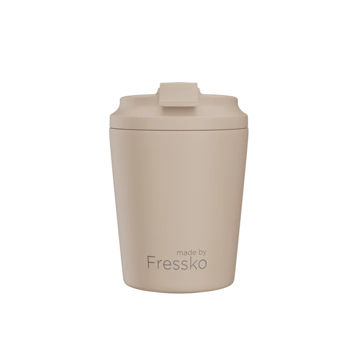 Beige tumbler with a lid on a white background, branded 'made by Fressko'.