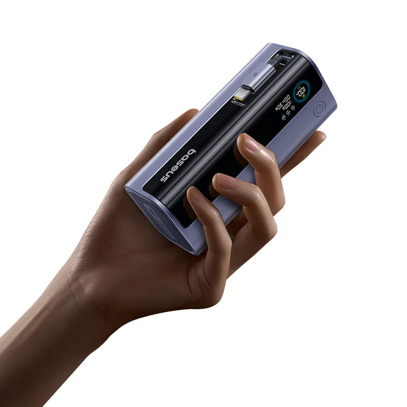 Hand holding a portable scanner with a white background