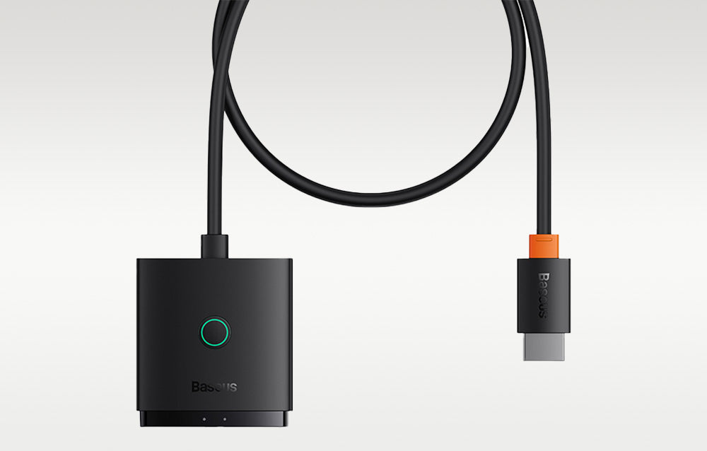 Black electronic device with a cable on a light gray background