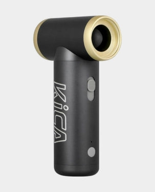 Black and gold handheld device with 'Kica' branding on a light gray background