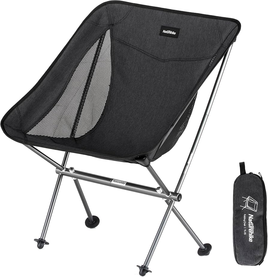 Black camping chair with carrying bag on a white background