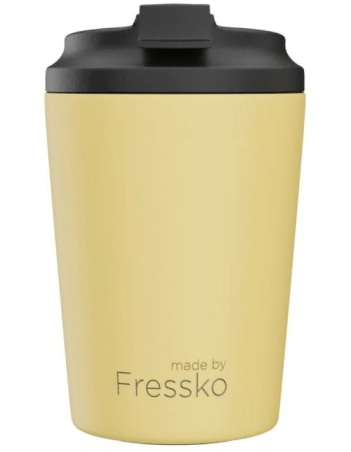 Yellow tumbler with black lid on a white background, branded 'made by Fressko'.