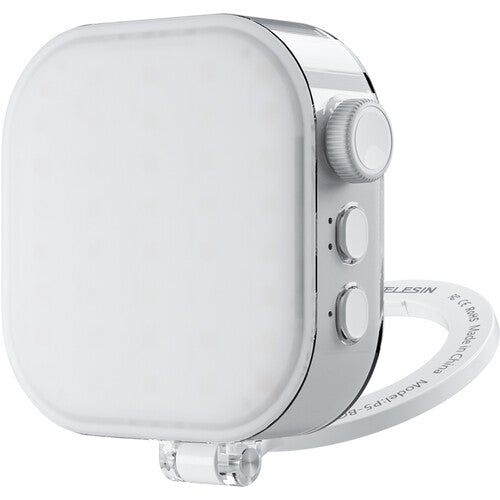 White electronic device with a circular dial on a white background