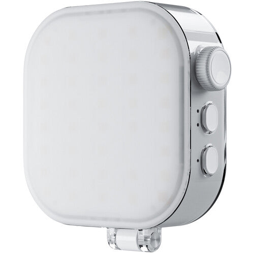 White electronic device with a dial on a white background