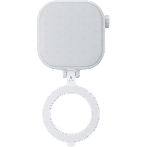 White handheld mirror with a square attachment on a white background