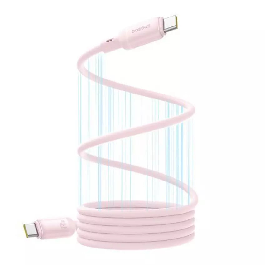 Pink charging cable coiled on a white background