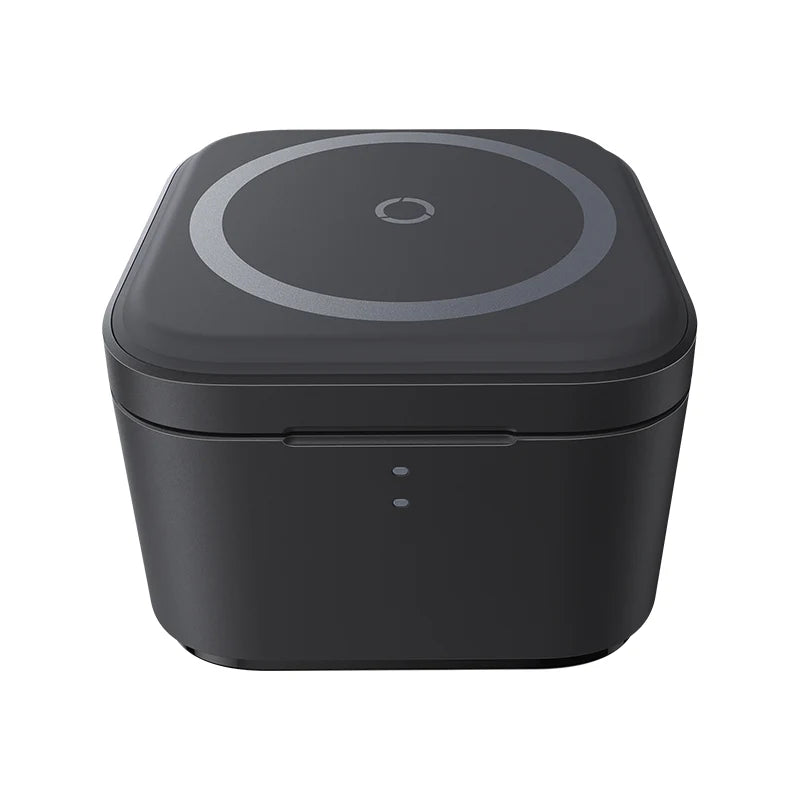 Black electronic device with a circular top section on a white background