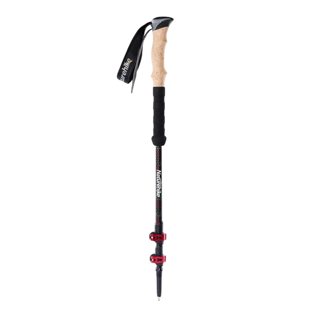 Trekking pole with cork handle and black shaft on a white background