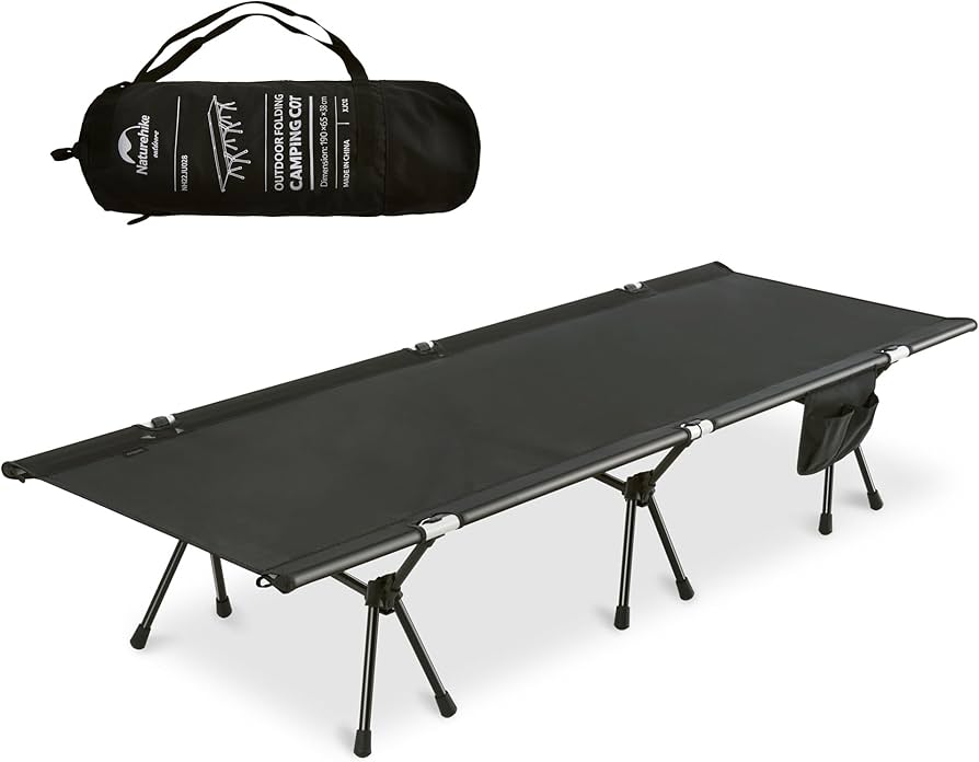 Black camping cot with carrying bag on a white background