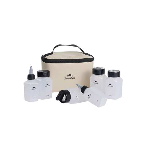 Set of white bottles with black caps and a beige cooler bag on a white background