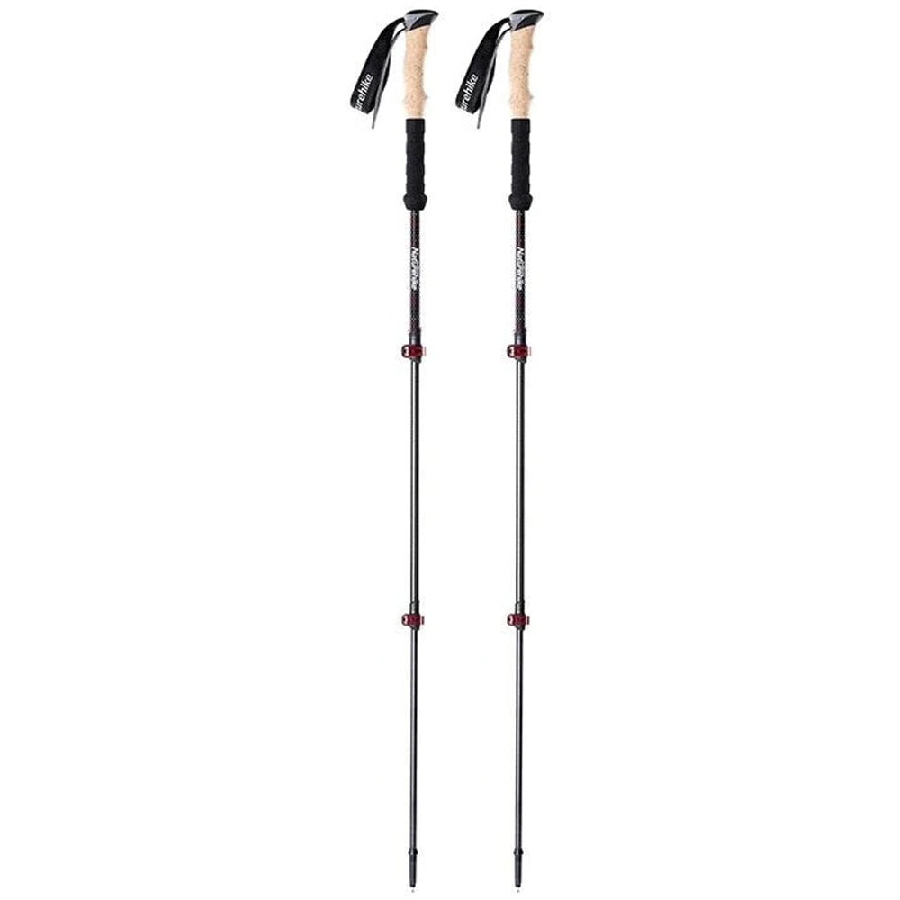 Two hiking poles with black and beige handles on a white background