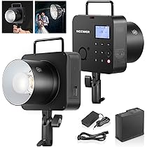 Studio light equipment with various attachments on a white background