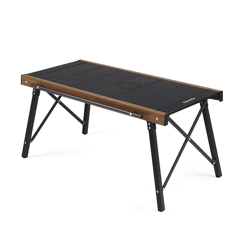 Portable folding table with black top and wooden sides on a white background