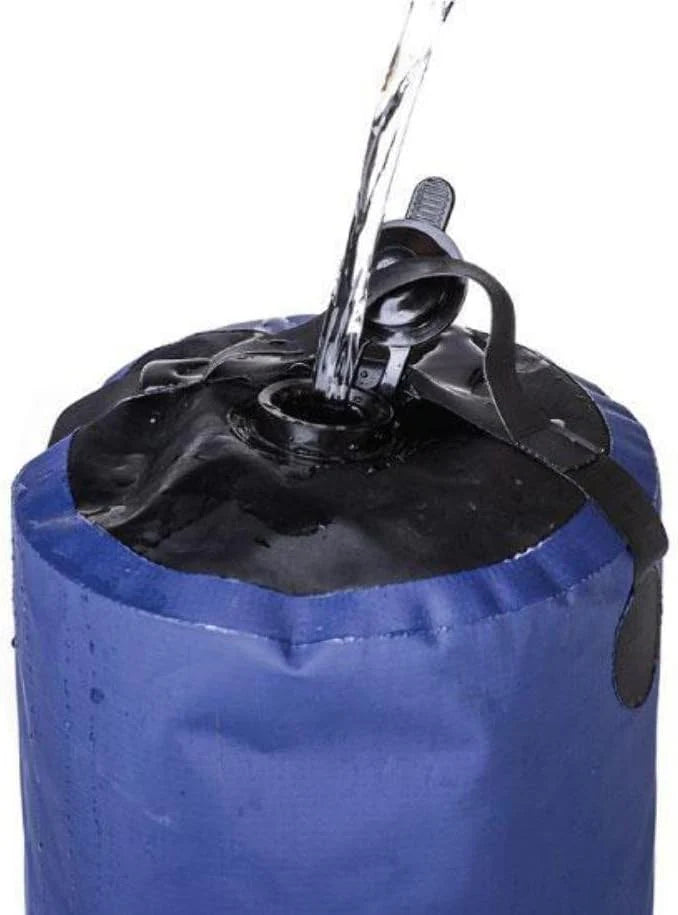 Blue sandbag with water being poured into it on a white background