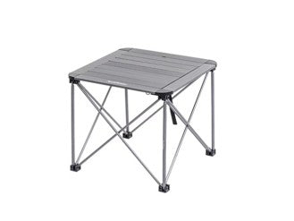 Portable camping table with metal frame and plastic surface on a white background
