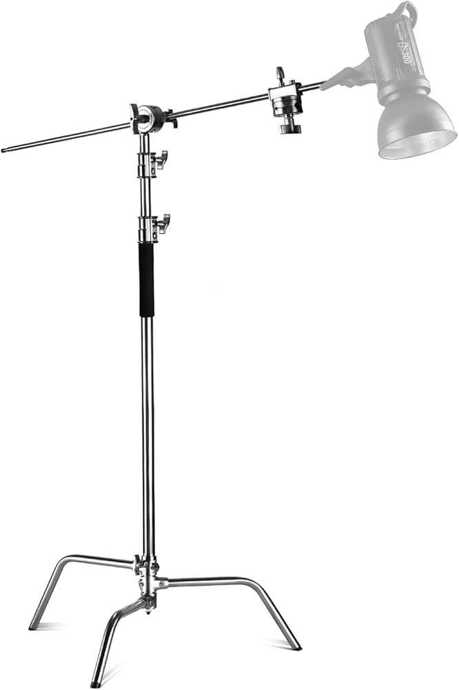 Studio light stand with adjustable arm and lamp head on a white background