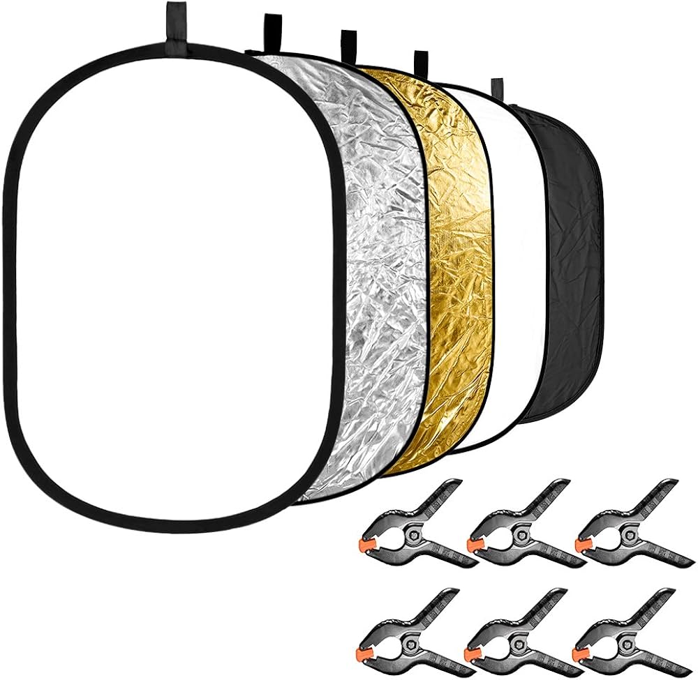 Foldable photography light modifier with reflective surfaces and clamps on a white background