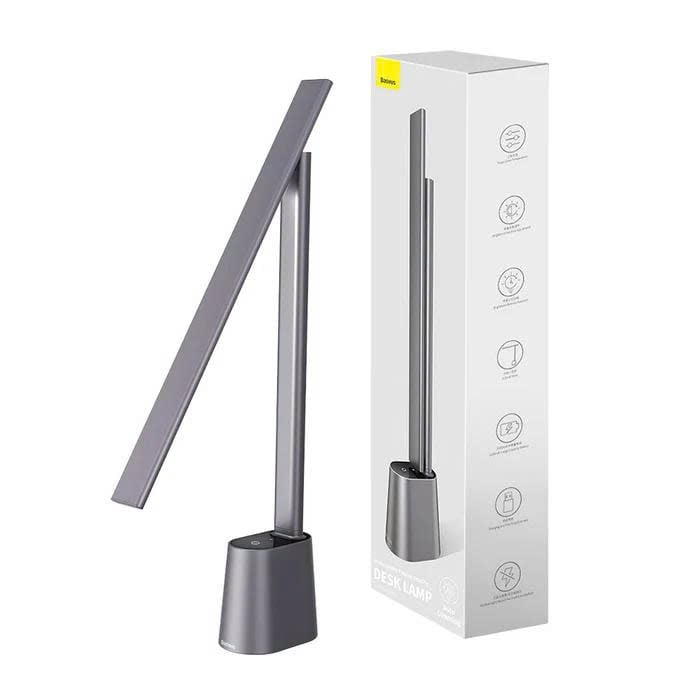 Gray desk lamp with packaging on a white background