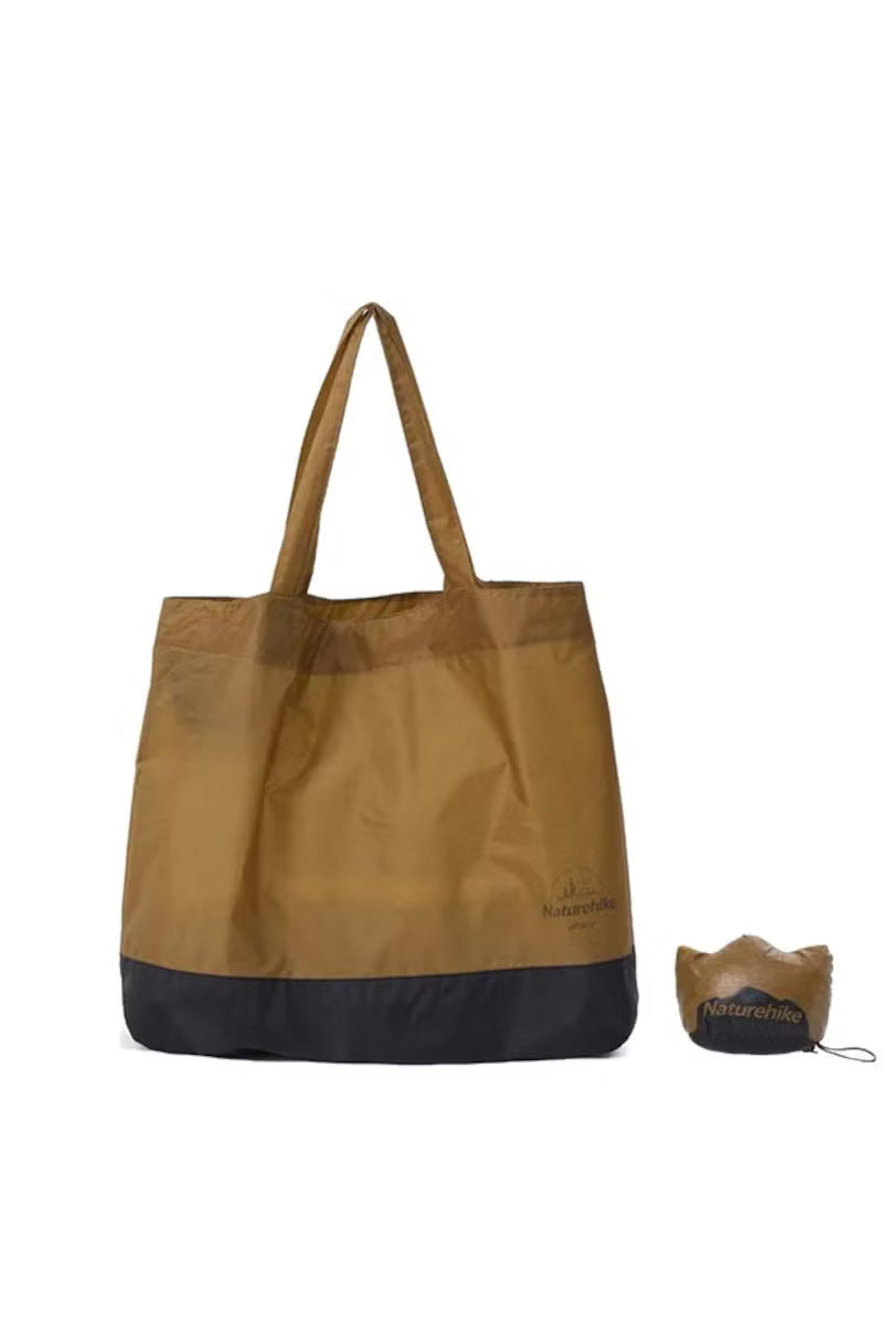 Brown and black tote bag with a smaller brown bag on a white background