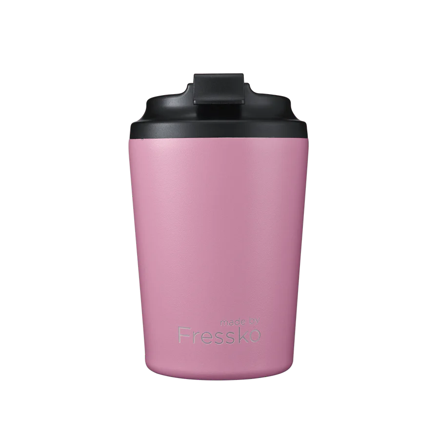 Pink thermos with black lid on a white background