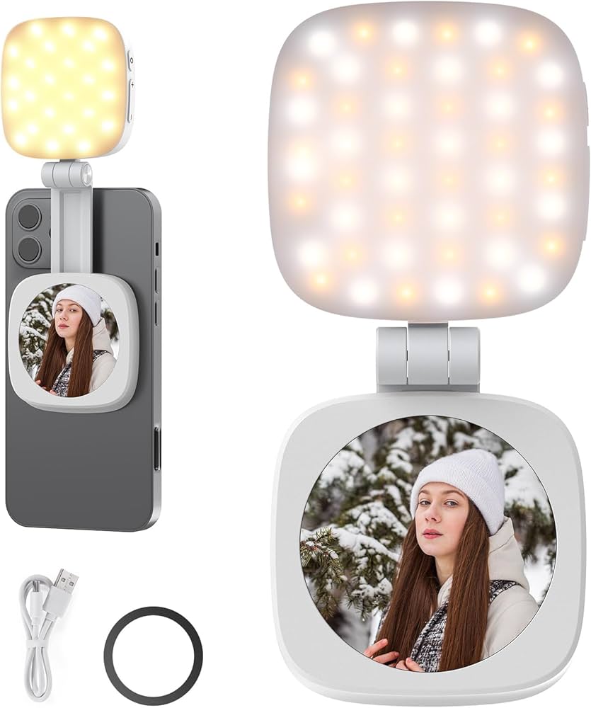 Two smartphone camera lights with a cable and lens cap on a white background