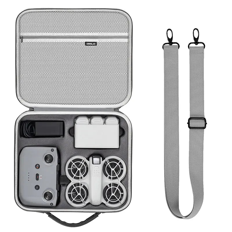 Gray carrying case with drone components and a strap on a white background