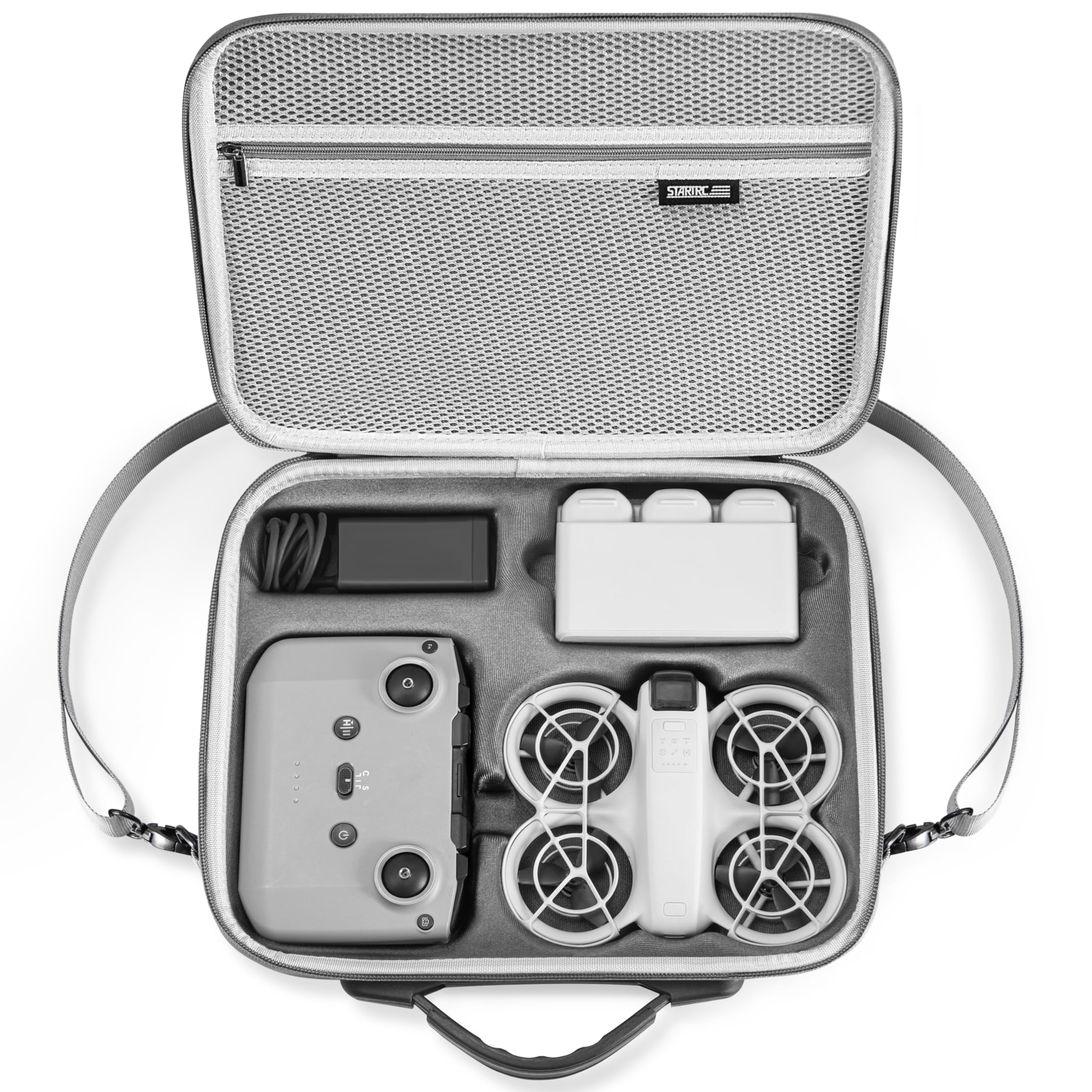 Portable electronic device with accessories in a carrying case on a white background