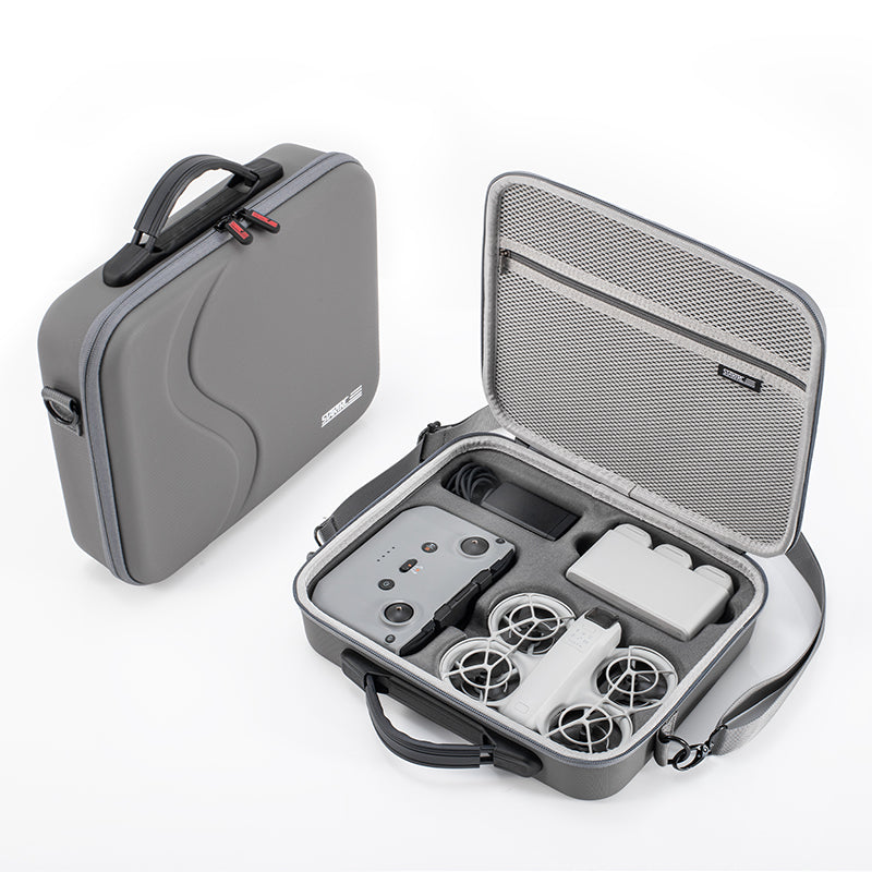 Gray carrying case with a drone and accessories on a white background