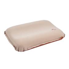 Beige pillow on a white background
