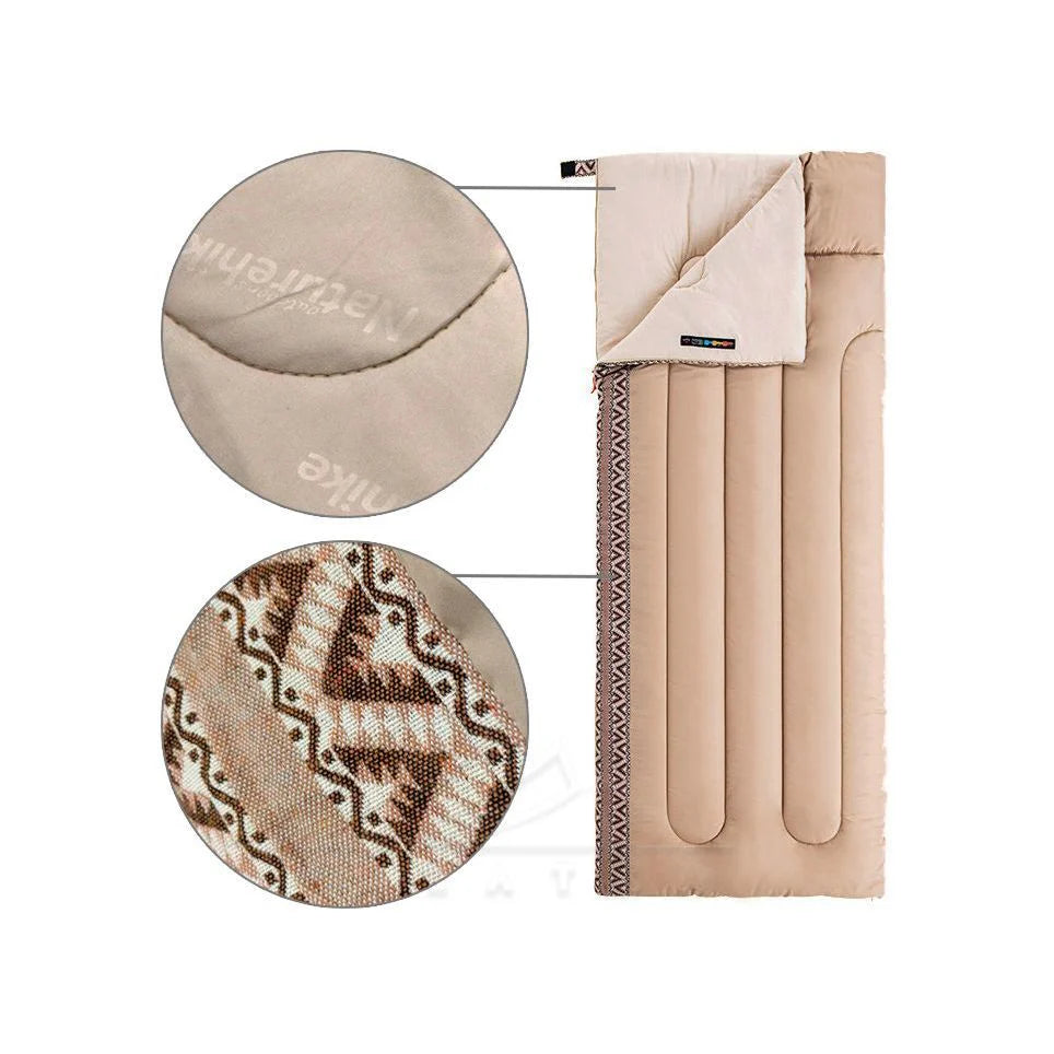 Beige blanket with patterned texture and visible brand logo on a white background