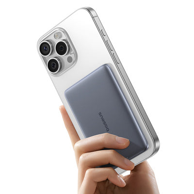 Smartphone with a clear case held in a hand on a white background