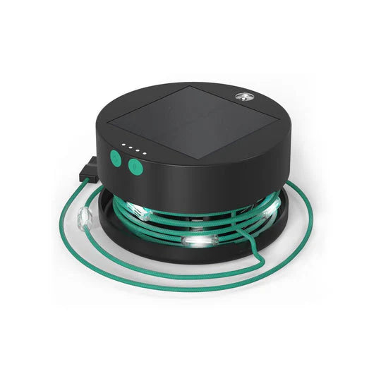 Black and green solar-powered device on a white background