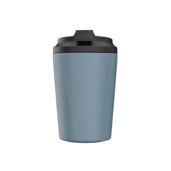 Blue tumbler with black lid on a white background