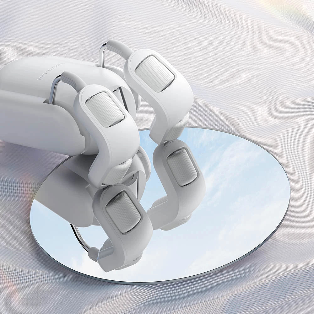 White suction cup with multiple hooks on a reflective surface