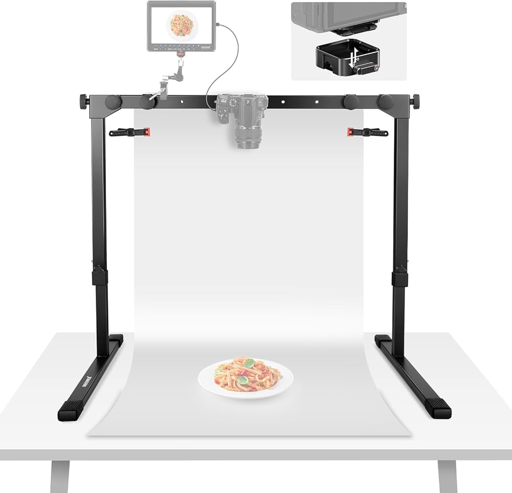 Food photography setup with a white background, camera, and lighting equipment.