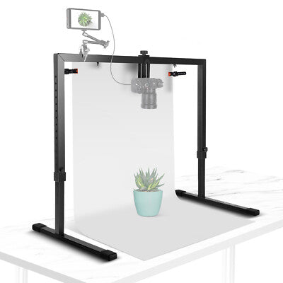 Photography studio light stand with a plant on a white background